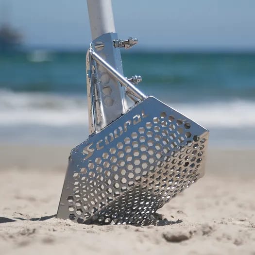 QUEST Scoopal Sand Scoop standing on a beach